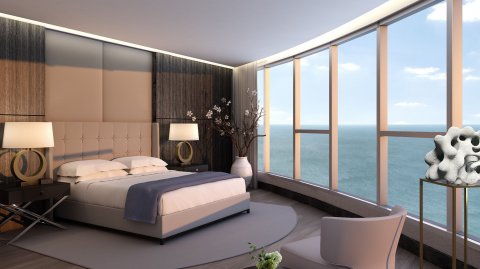 Una habitación con una vista panorámica de la costa.