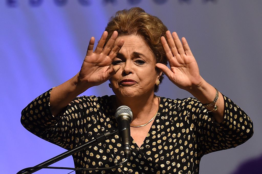 Brazilian President Dilma Rousseff gestures  during the opening ceremony of the 4th National Policy Conference on Women in Brasilia on May 10, 2016.Brazilian President Dilma Rousseff launched a last-minute bid Tuesday to block impeachment proceedings against her in what could be her final hours in power. / AFP / EVARISTO SA        (Photo credit should read EVARISTO SA/AFP/Getty Images)