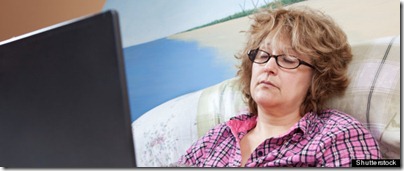 Sick day, businesswoman working from home; Shutterstock ID 95012227; PO: The Huffington Post; Job: The Huffington Post; Client: The Huffington Post; Other: The Huffington Post