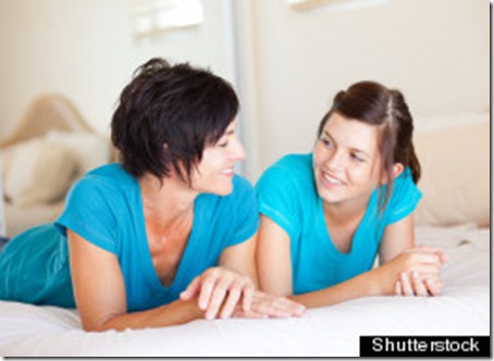 middle aged mother and teen daughter chatting on bed; Shutterstock ID 95587969; PO: The Huffington Post; Job: The Huffington Post; Client: The Huffington Post; Other: The Huffington Post