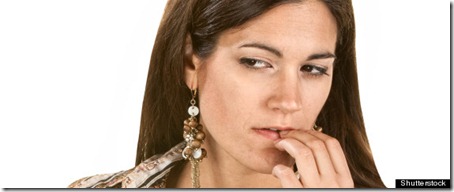 Pensive woman in long hair with fingers on lips; Shutterstock ID 111261389; PO: The Huffington Post; Job: The Huffington Post; Client: The Huffington Post; Other: The Huffington Post