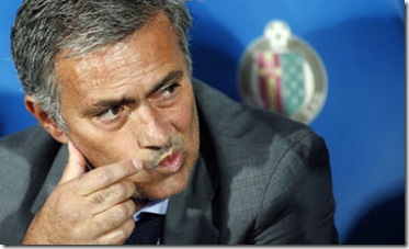 Real Madrid's coach Mourinho reacts before their Spanish first division soccer match against Getafe in Getafe