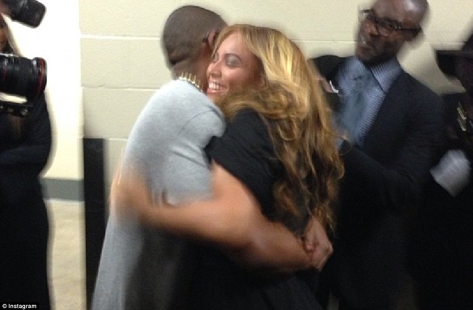Congratulations: Beyonce is hugged by husband Jay-Z following her successful performance 