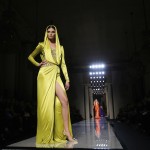 A model presents a creation by Italian designer Donatella Versace as part of her Haute Couture Spring/Summer 2014 fashion show for Atelier Versace in Paris