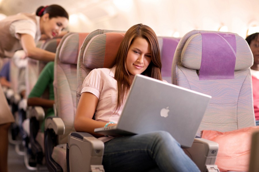 wifi-girl-working-on-board-with-mac