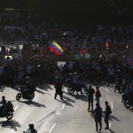 Opposition demonstrators block the city's main highway during a protest against Nicolas Maduro's government in Caracas