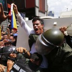 Venezuelan opposition leader Leopoldo Lopez gets into a National Guard armored vehicle in Caracas