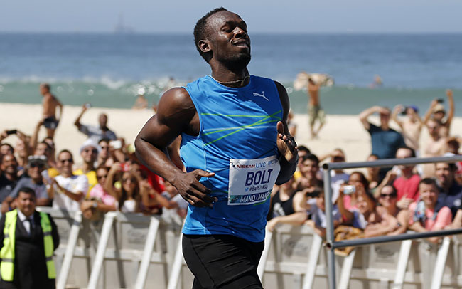 Bolt runs after winning the "Mano a Mano" men's 100 metres challenge in Rio de Janeiro