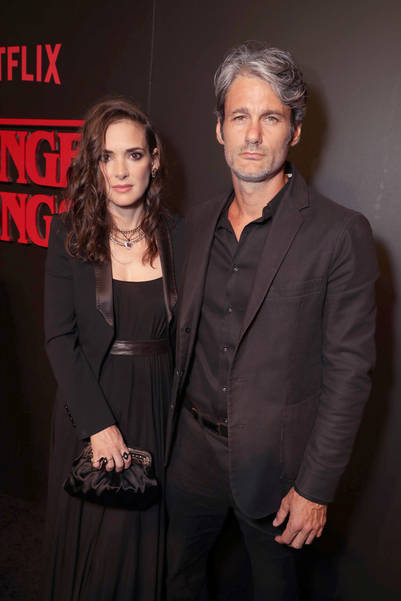 Winona Ryder and Scott Hahn seen at the red carpet premiere in support of the launch of the Netflix original series "Stranger Things" at Mack Sennett Studios on Monday, July 11, 2016, in Los Angeles, CA. (Photo by Eric Charbonneau/Invision for Netflix/AP Images)