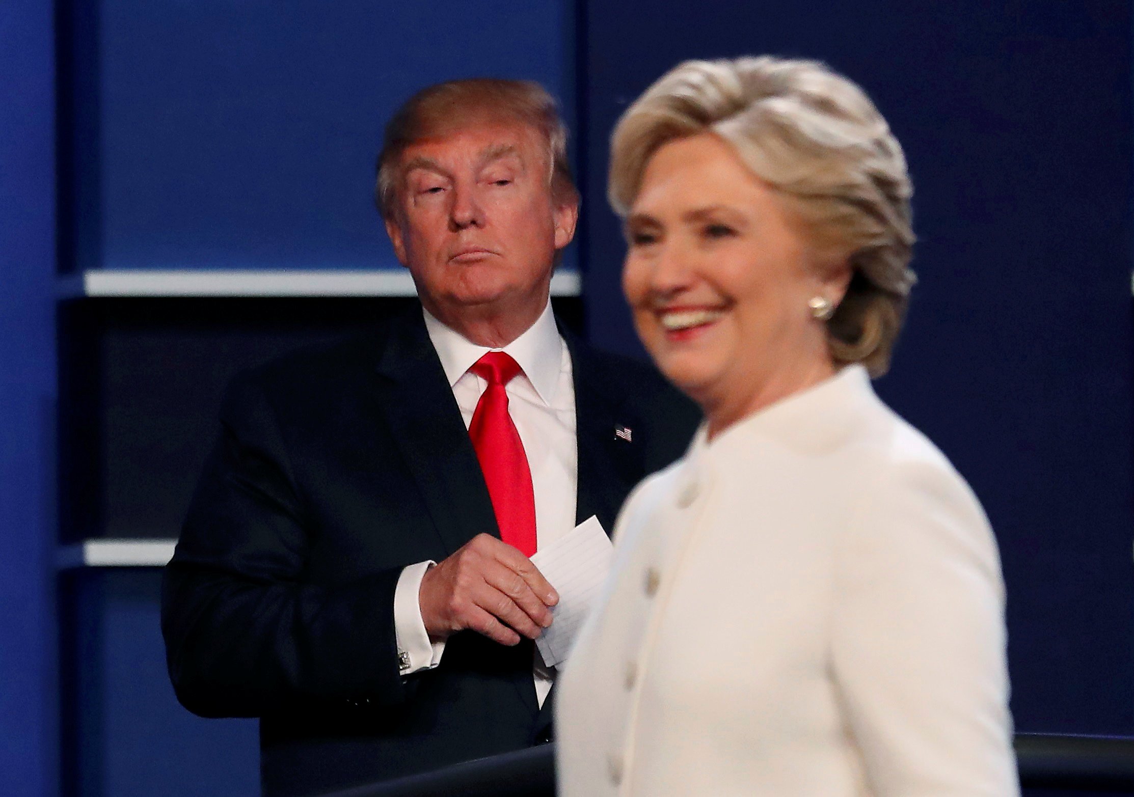 Republican U.S. presidential nominee Donald Trump and Democratic U.S. presidential nominee Hillary Clinton finish their third and final 2016 presidential campaign debate at UNLV in Las Vegas, Nevada, U.S., October 19, 2016. REUTERS/Mike Blake TPX IMAGES OF THE DAY