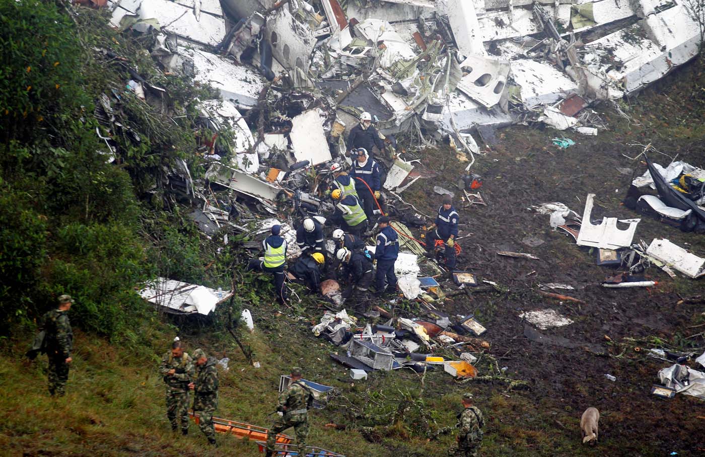ATTENTION EDITORS - VISUAL COVERAGE OF SCENES OF INJURY OR DEATHRescue crew work in the wreckage from a plane that crashed into Colombian jungle with Brazilian soccer team Chapecoense, seen near Medellin, Colombia, November 29, 2016. REUTERS/Fredy Builes TEMPLATE OUT