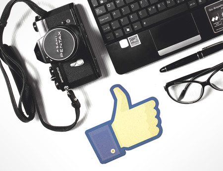 Stockvault Facebook Thumbs Up With Laptop And Camera183705