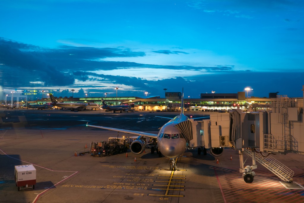 Singapore, Singapore – February 25, 2016: Airplanes at the terminal in Singapore Changi airport at the dusk. Singapore 2016