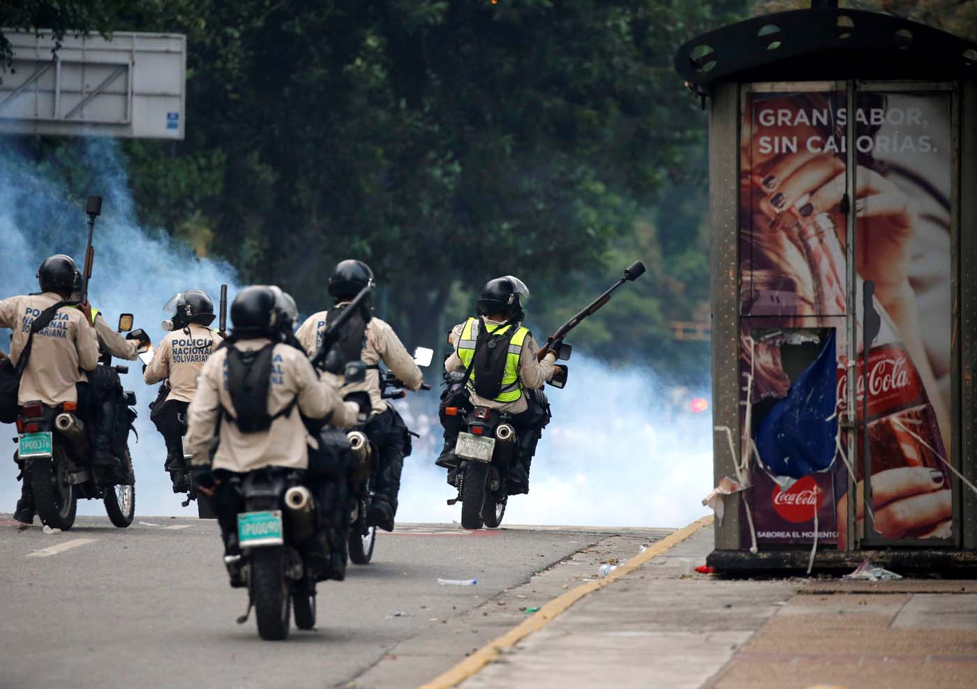 Riot police take positions during the so called "mother of all marches" against Venezuela