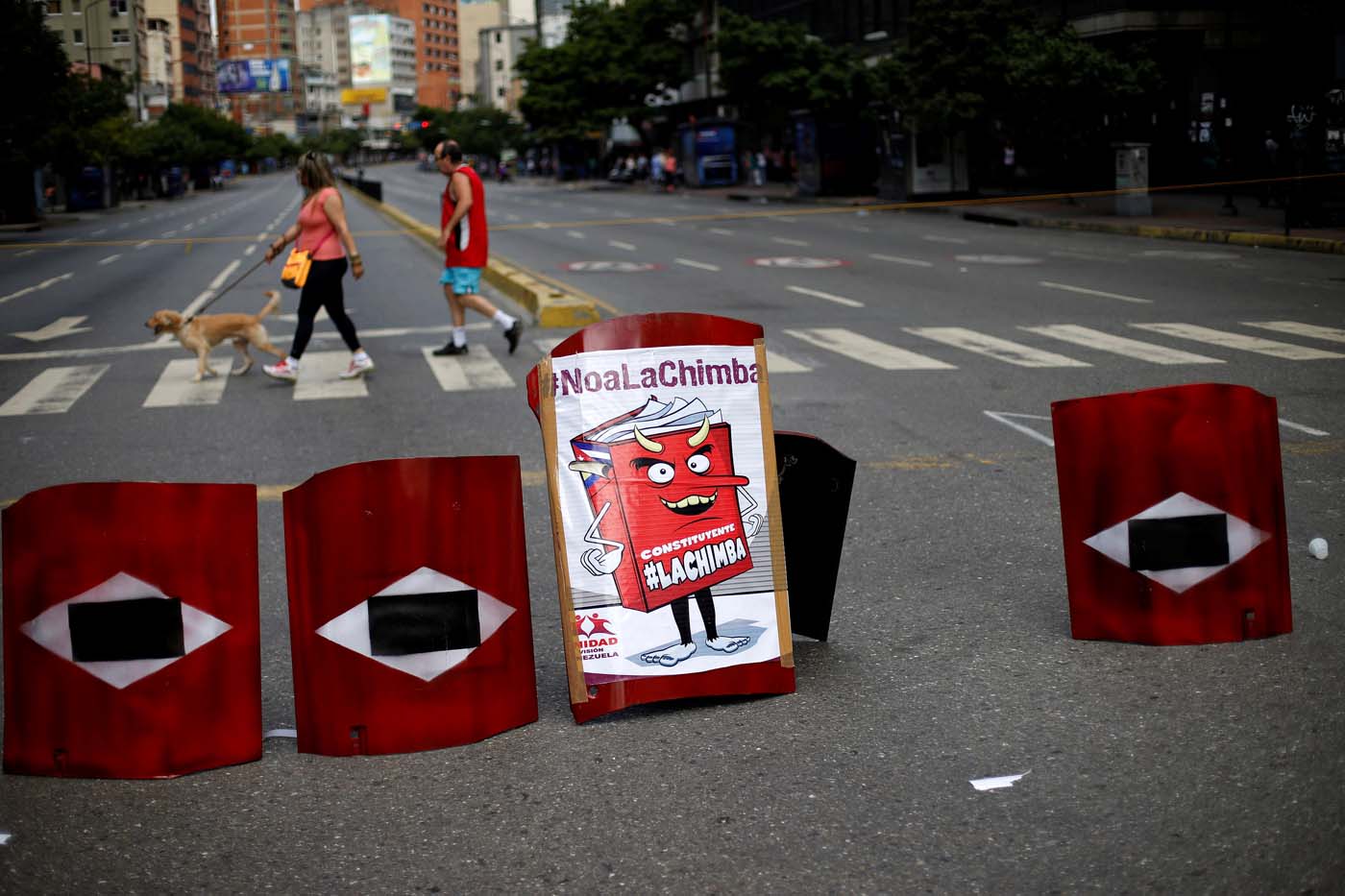 Makeshift shields lie on a blocked road during a strike called to protest against Venezuelan President Nicolas Maduro