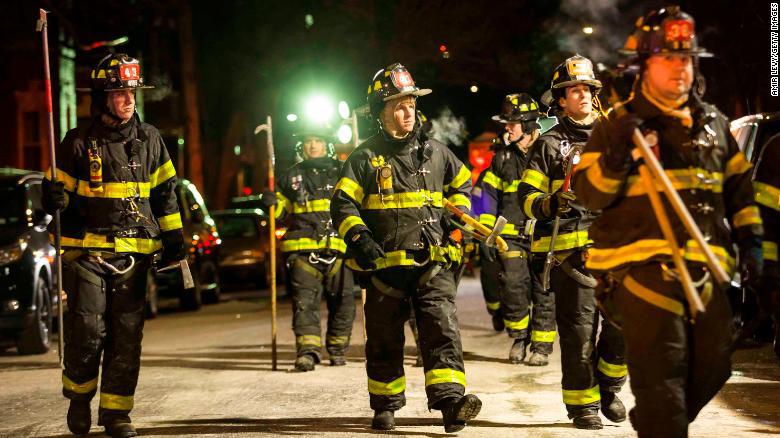 NEW YORK, NY - DECEMBER 28:Firefighters leave after putting out a major house fire on Prospect avenue on December 28, 2017 in the Bronx borough of New York City. Over 170 firefighters respond to the evening fire in which at least 12 persons were killed with others injured. (Photo by Amir Levy/Getty Images)