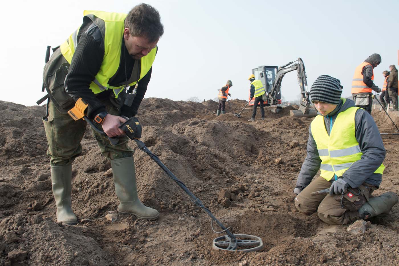 Amateur archaeologist Rene Schoen (L) and 13-year-old student Luca Malaschnichenko look for a treasure with a metal detector in Schaprode, northern Germany on April 13, 2018. The 13-year-old boy and the hobby archaeologist have unearthed a "significant" trove in Germany which may have belonged to the legendary Danish king Harald Bluetooth who brought Christianity to Denmark. A dig covering 400 square metres (4,300 square feet) that finally started over the weekend by the regional archaeology service has since uncovered a trove believed linked to the Danish king who reigned from around 958 to 986. Braided necklaces, pearls, brooches, a Thor