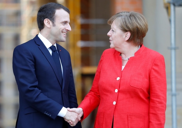 Junto a Angela Merkel, canciller alemana
