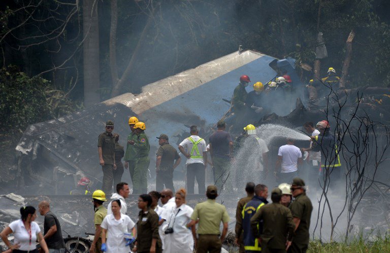 Emergency personnel work at the site of the accident after a Cubana de Aviacion aircraft crashed after taking off from Havana