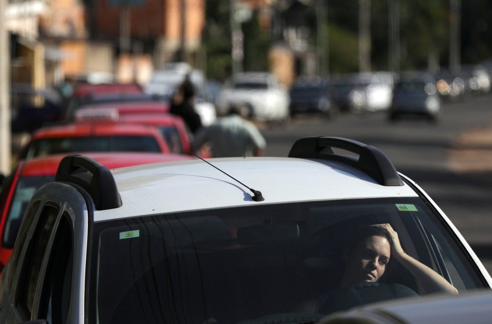 A woman waits in line at a gas station in Porto Alegre, Brazil May 29, 2018. REUTERSDiego Vara