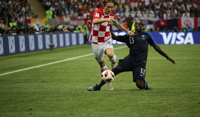 Luka Modric of Croatia, left, plays past NGolo Kante of France during the FIFA World Cup final match in Moscow, Russia, on Sunday, July 15, 2018. President Vladimir Putin spent six years and more than billion preparing nearly a dozen Russian cities to host the soccer World Cup, the biggest such event the countrys held since the collapse of the Soviet Union. Photographer: Andrey Rudakov/Bloomberg