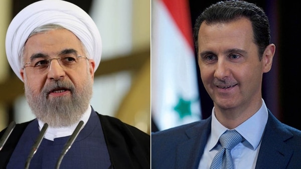 Hasan Rohani, presidente de Irán, y Bashar al Assad, de Siria