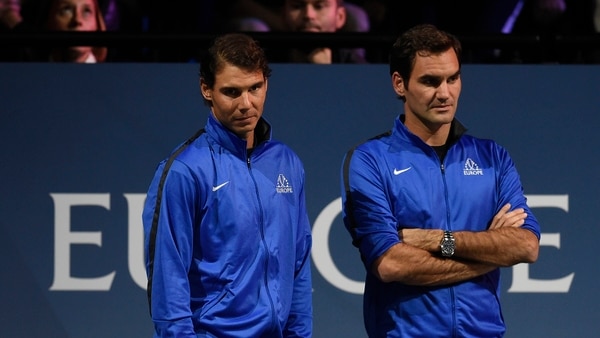 AFP PHOTO / Nadal y Federer jugaron juntos en dobles el año pasado