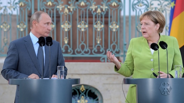 Vladimir Putin y Angela Merkel (Reuters)