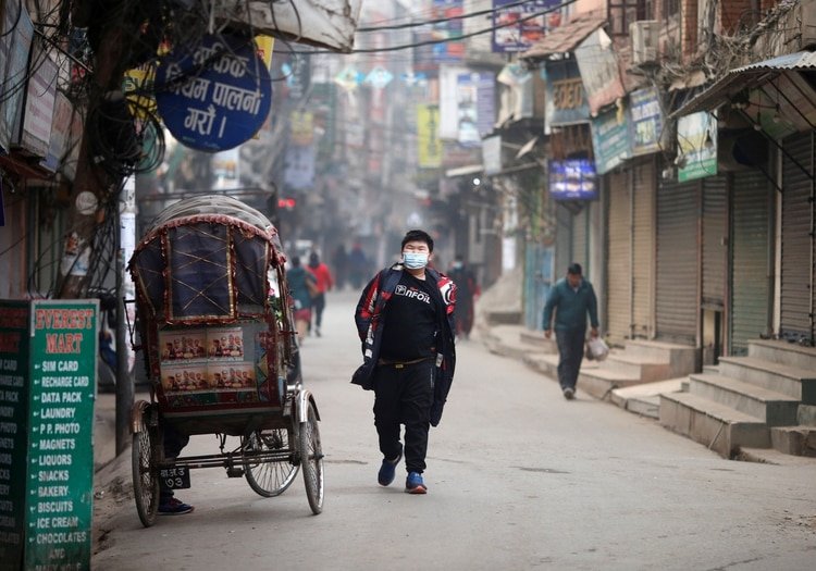 A man wears a mask as a preventive measure against the coronavirus outbreak, in Kathmandu, Nepal February 16, 2020. REUTERS/Soe Zeya Tun